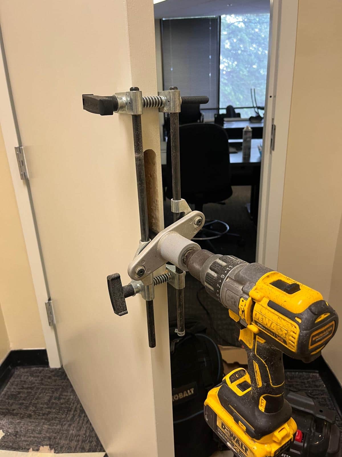 Licensed locksmith installing a new door lock