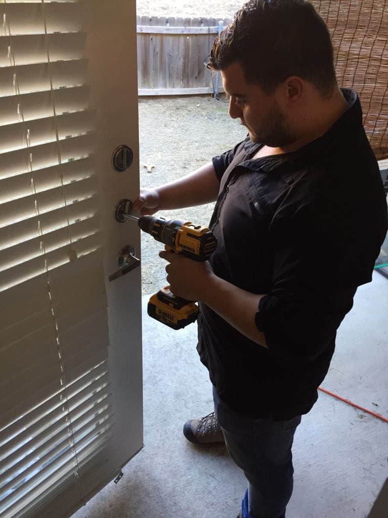 Residential door lock repair in progress