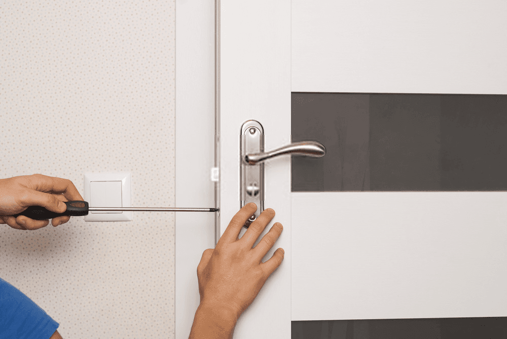 San Antonio locksmith rekeying an apartment door lock cylinder